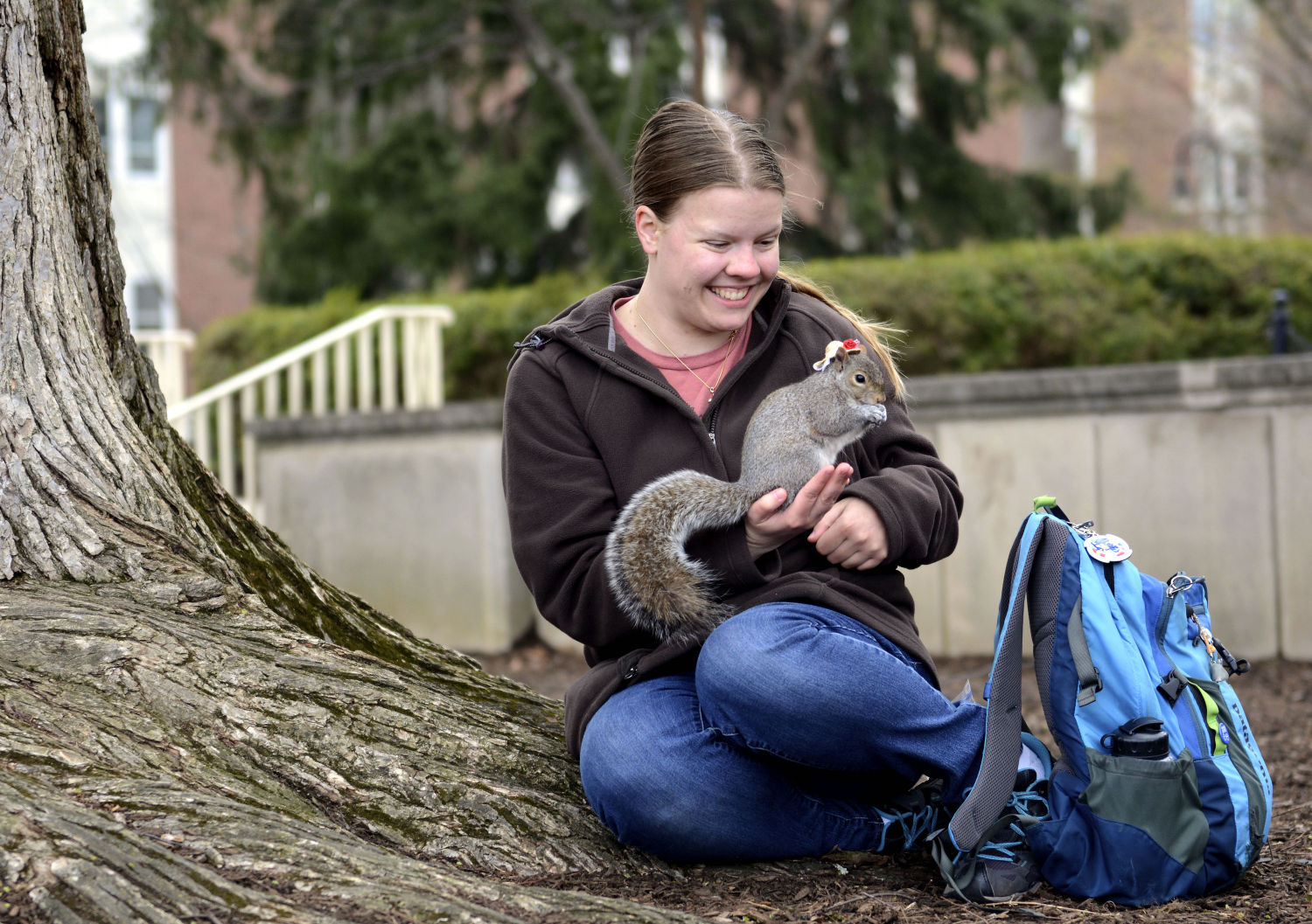 Squirrel Girl sits with "Sneezy the Penn State Squirrel"